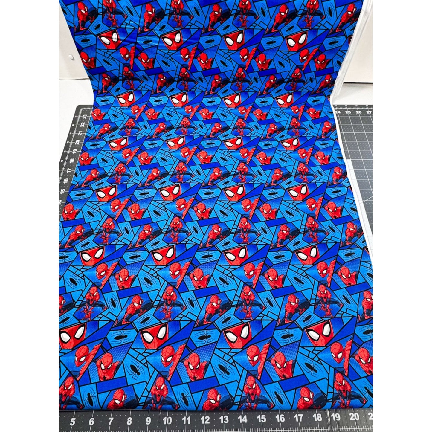 Marvel Spiderman Fabric on Blue with Black Spiders - Mary Jo Fabrics