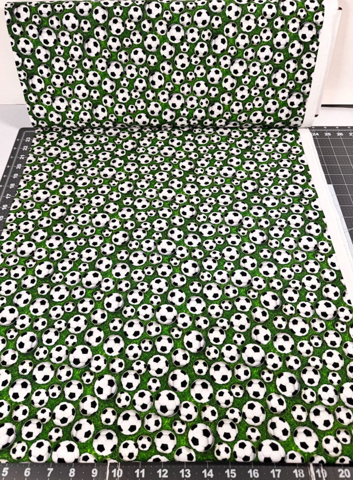 Soccer fabric 59-7771 White Soccer Balls on Grass fabric - Mary Jo Fabrics