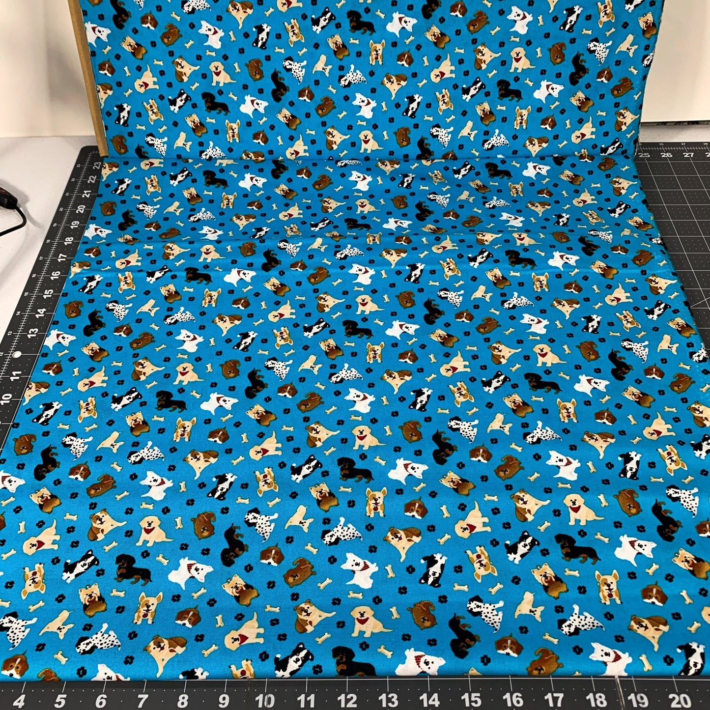 Tossed Puppy Dog fabric 1556 - 6706 Teal Novelty pups - Mary Jo Fabrics