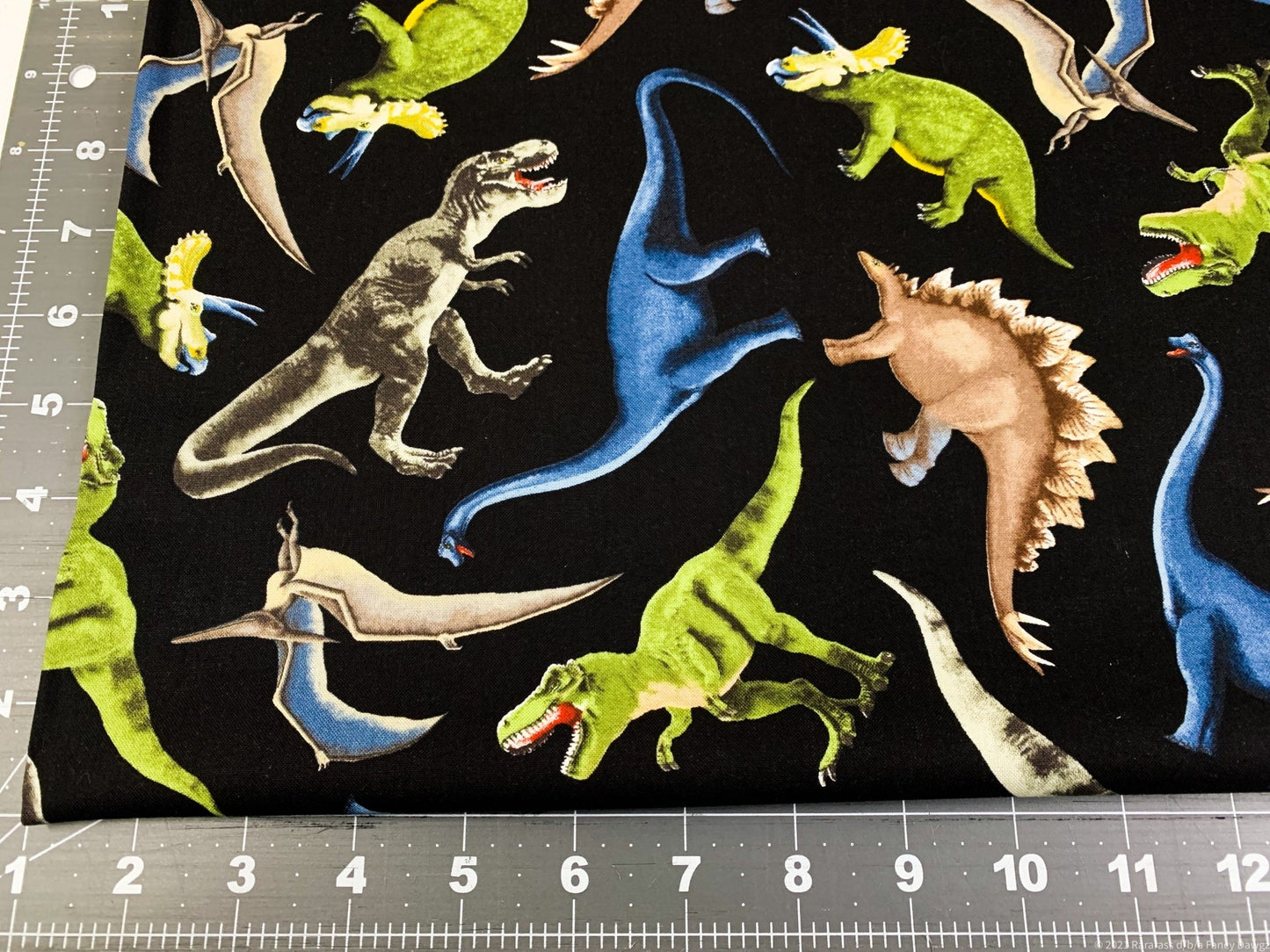 Green dinosaur fabric C5726 dinosaurs cotton - Mary Jo Fabrics