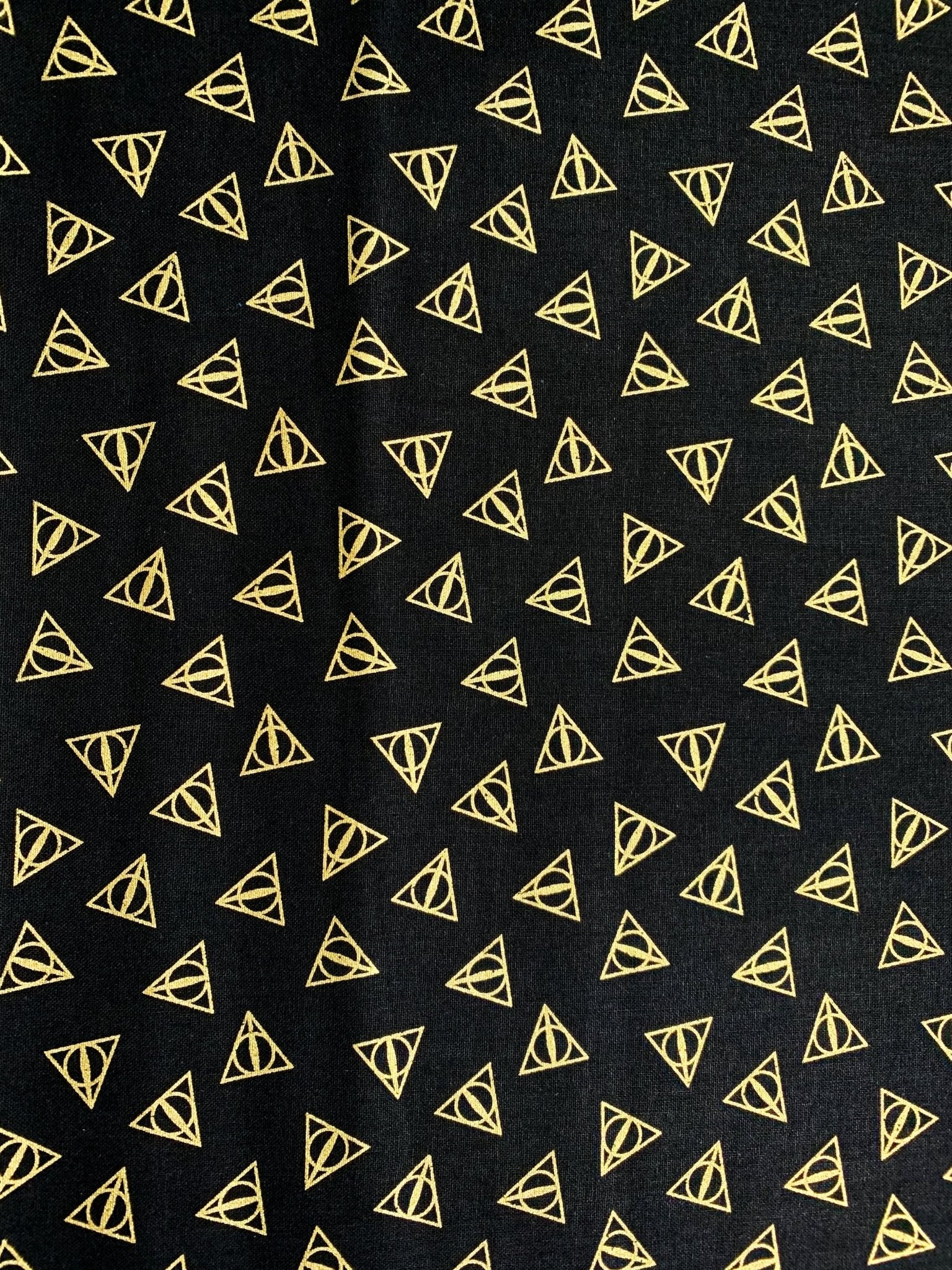 Harry Potter fabric Gold Metallic Deathly Hallows Logo - Mary Jo Fabrics