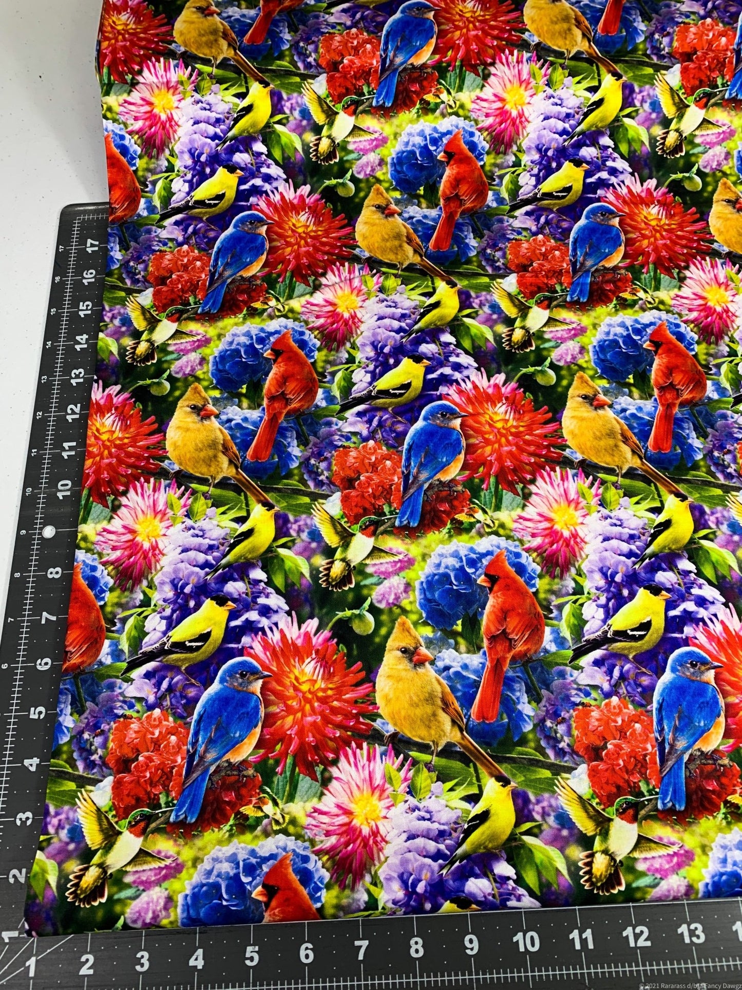 Hummingbird and Red Cardinal fabric in the flower garden - Mary Jo Fabrics