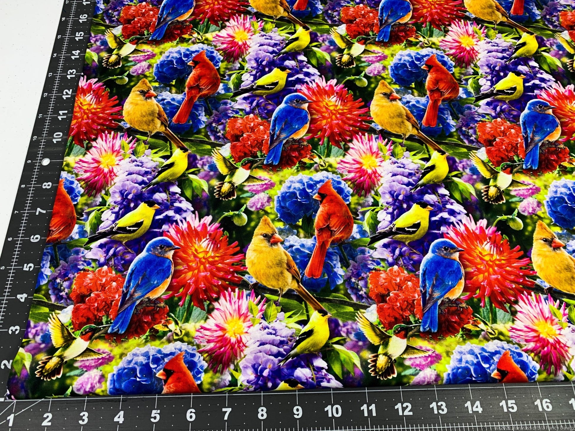 Hummingbird and Red Cardinal fabric in the flower garden - Mary Jo Fabrics