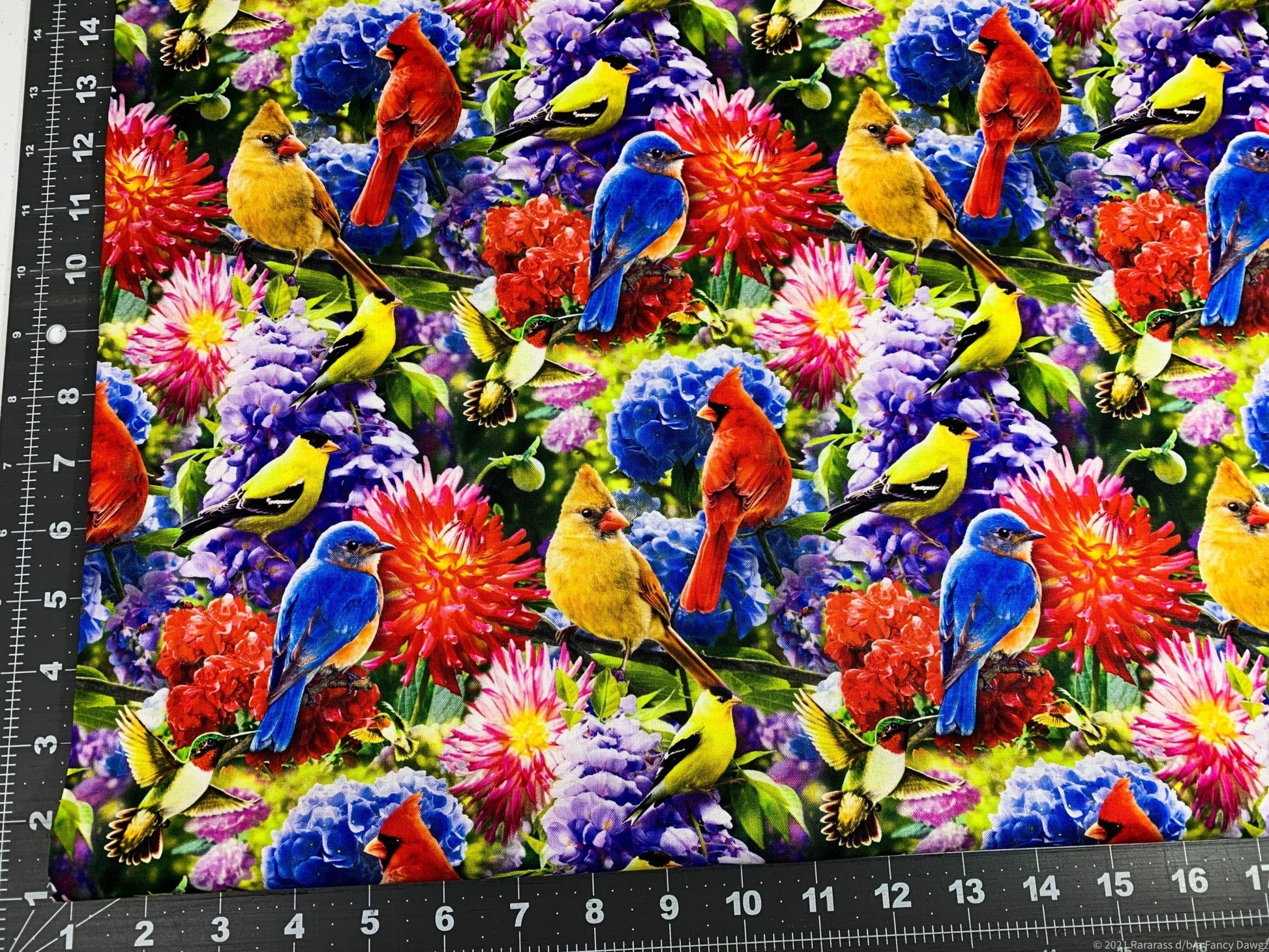 Hummingbird and Red Cardinal fabric in the flower garden - Mary Jo Fabrics