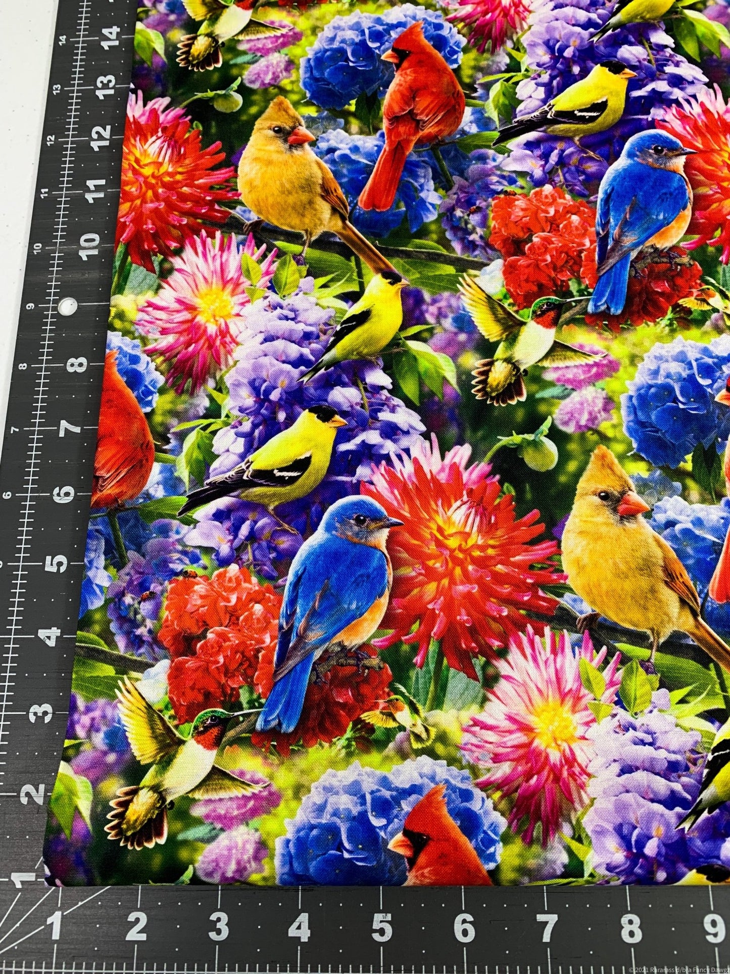 Hummingbird and Red Cardinal fabric in the flower garden - Mary Jo Fabrics