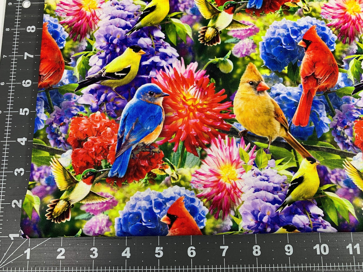 Hummingbird and Red Cardinal fabric in the flower garden - Mary Jo Fabrics