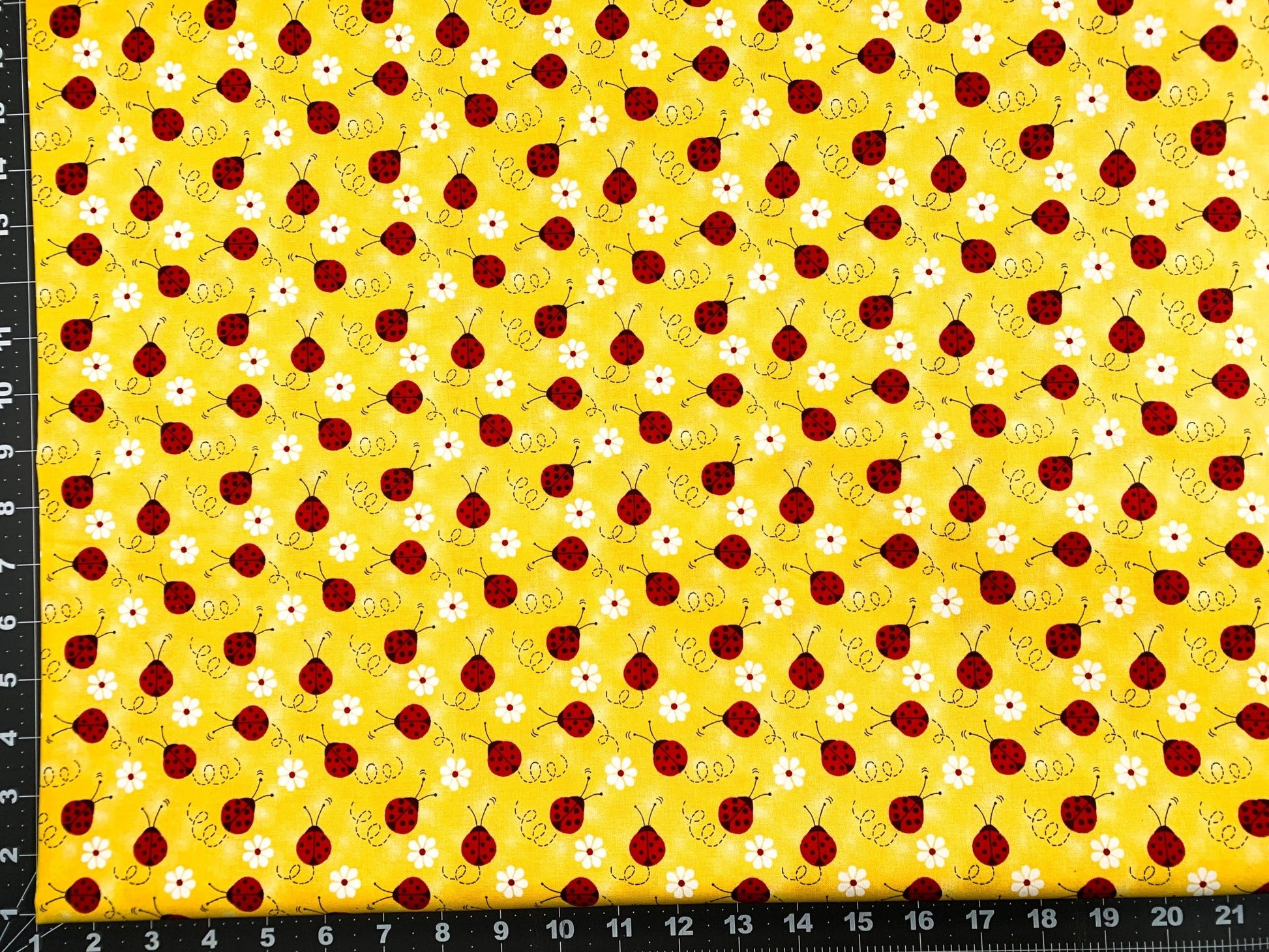 Ladybug fabric Red Ladybug with a daisy cotton fabric - Mary Jo Fabrics