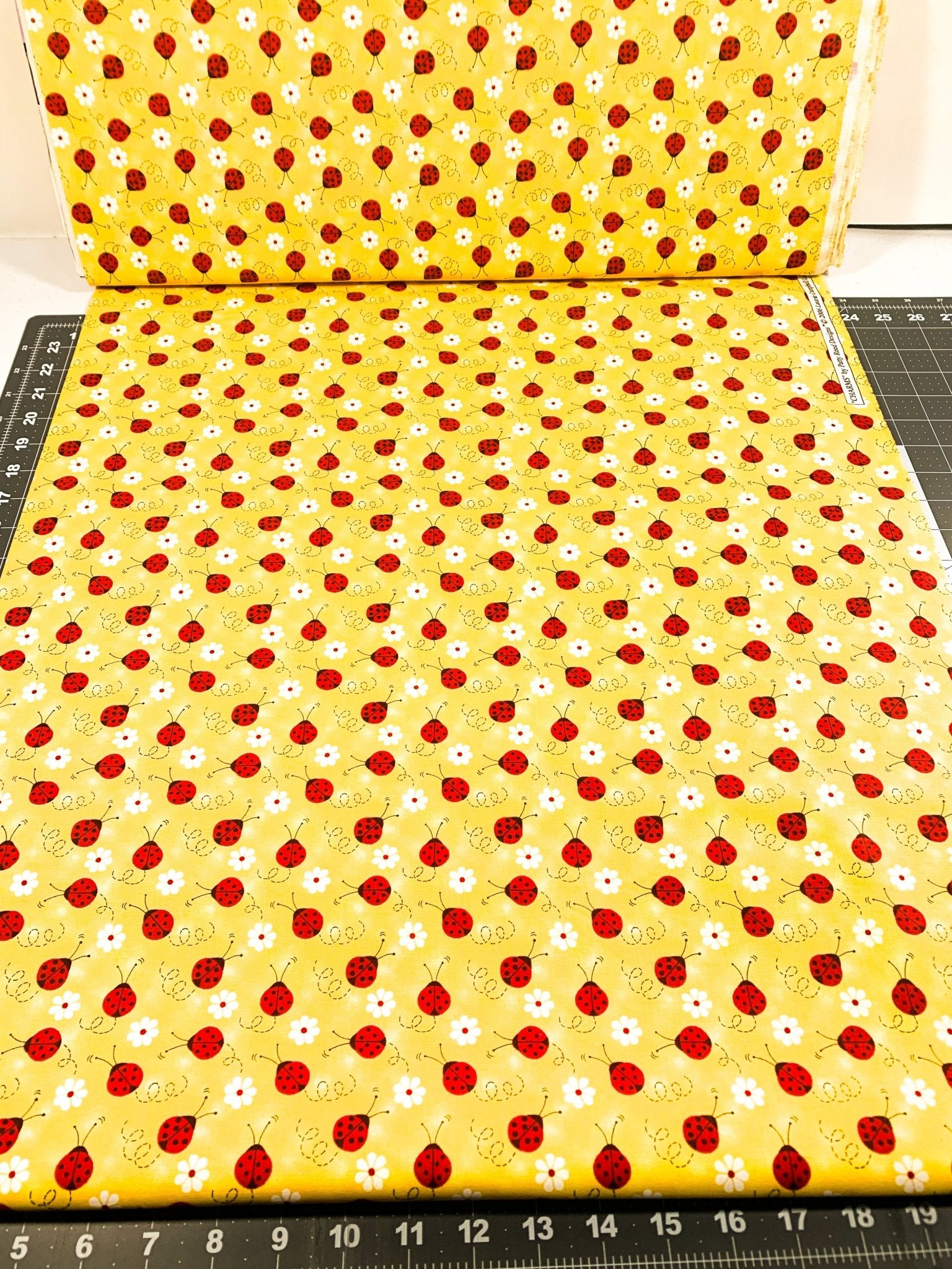 Ladybug fabric Red Ladybug with a daisy cotton fabric - Mary Jo Fabrics