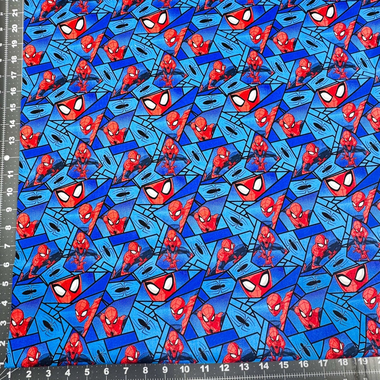Marvel Spiderman Fabric on Blue with Black Spiders - Mary Jo Fabrics