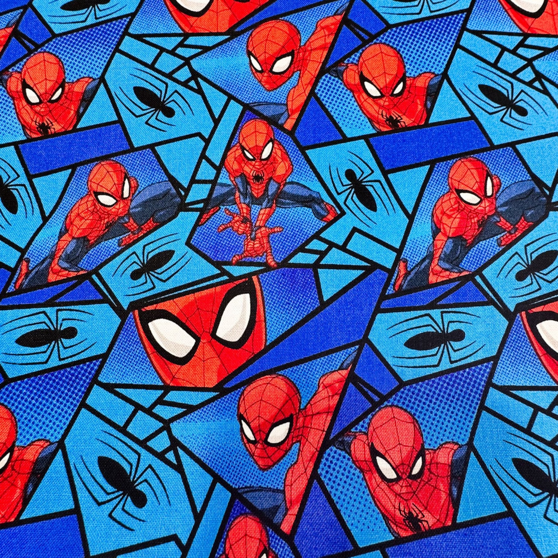 Marvel Spiderman Fabric on Blue with Black Spiders - Mary Jo Fabrics