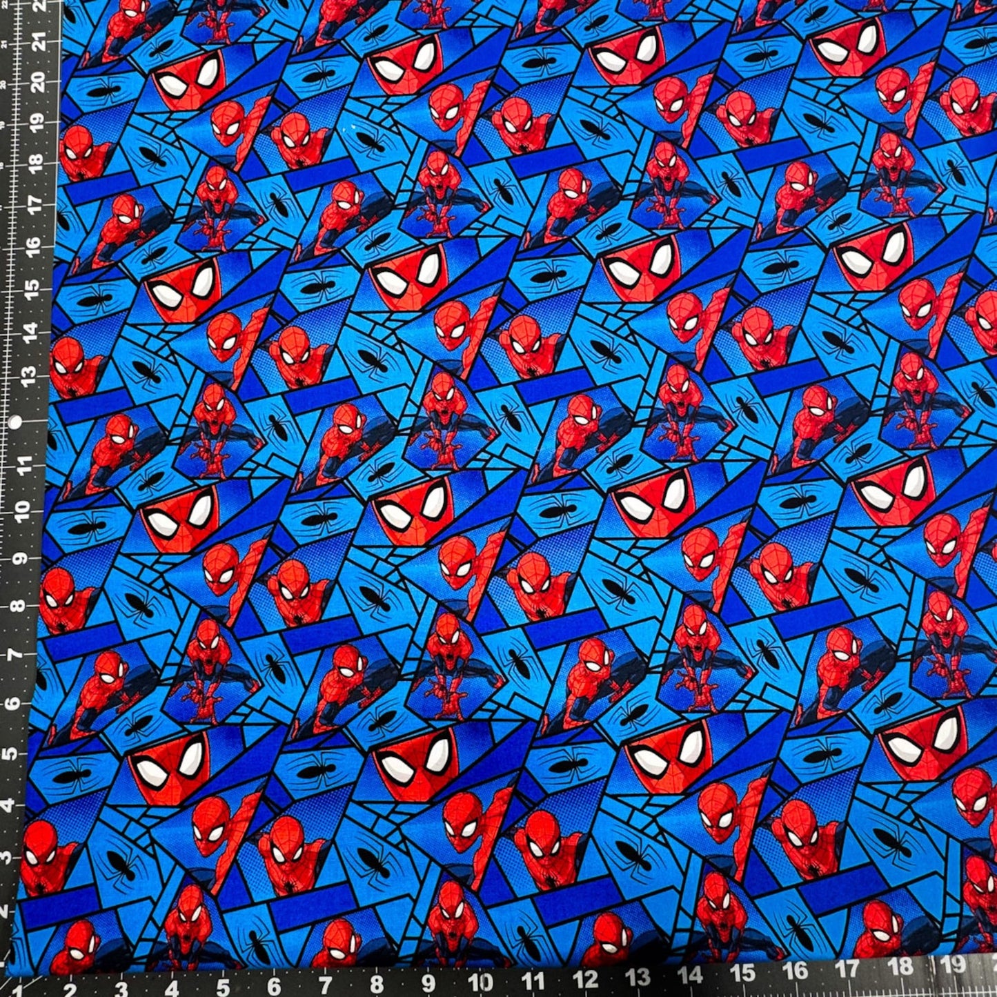Marvel Spiderman Fabric on Blue with Black Spiders - Mary Jo Fabrics