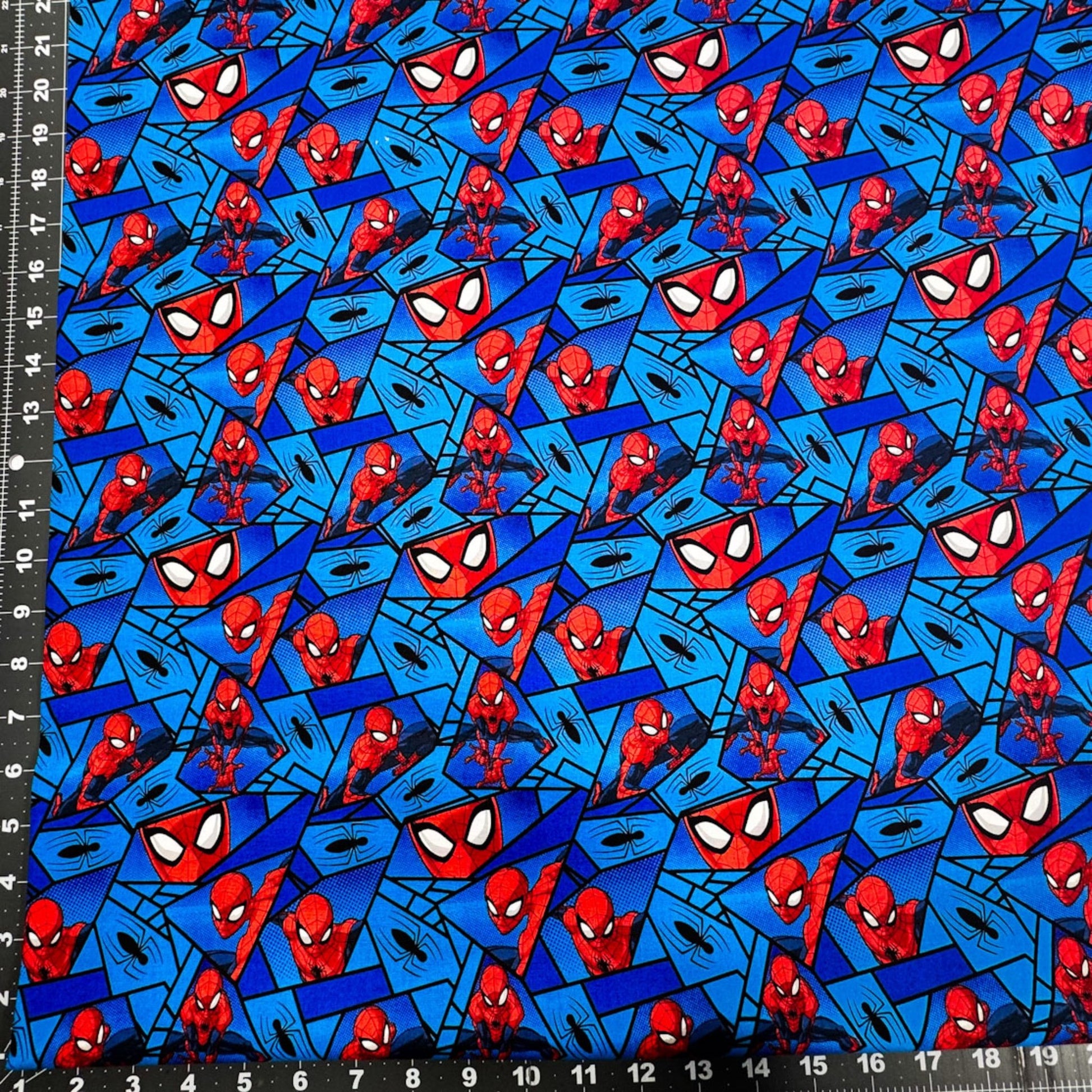 Marvel Spiderman Fabric on Blue with Black Spiders - Mary Jo Fabrics