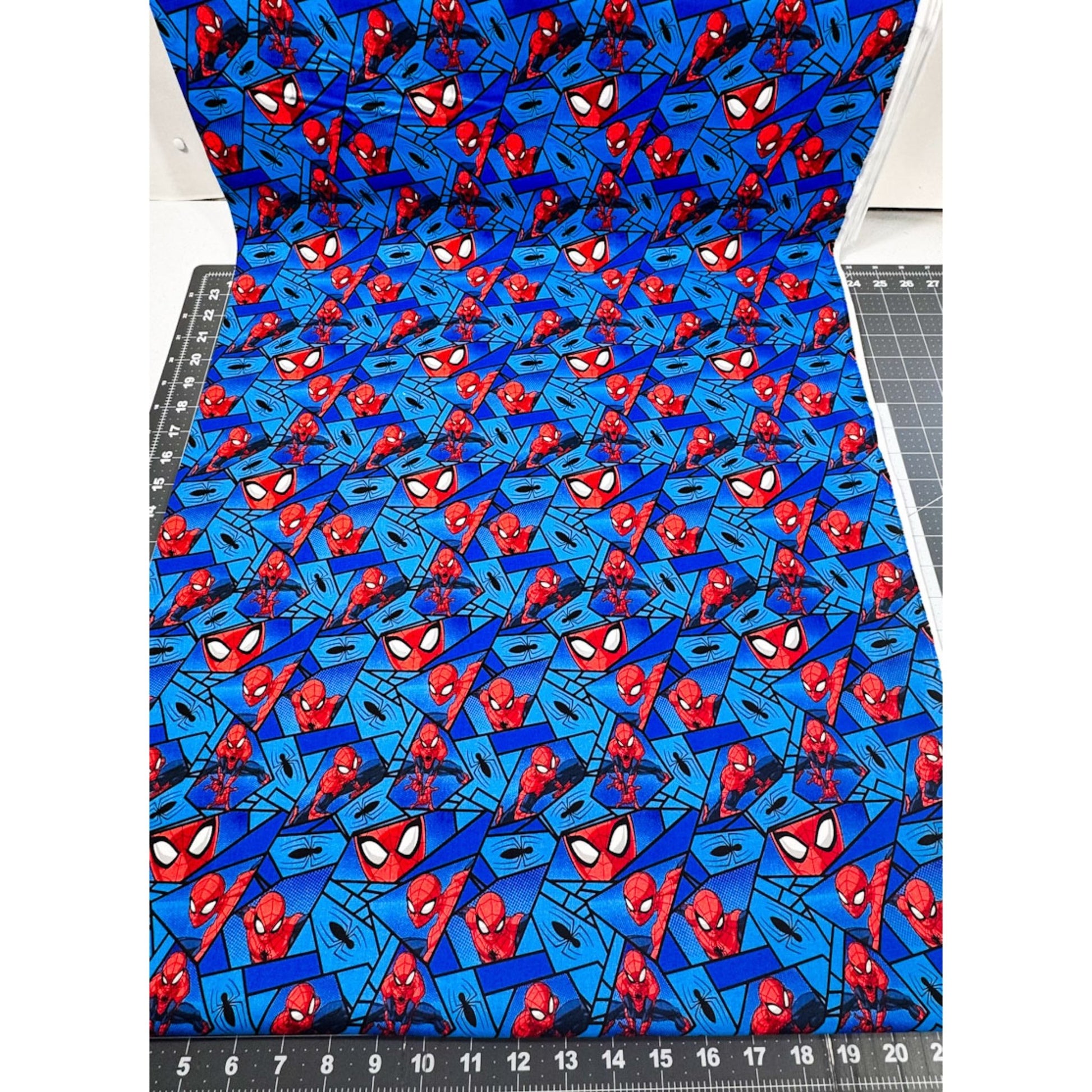 Marvel Spiderman Fabric on Blue with Black Spiders - Mary Jo Fabrics