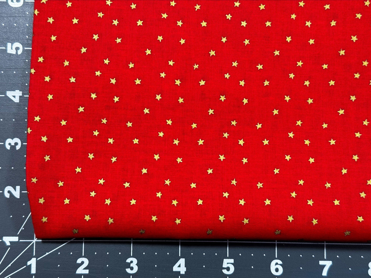 Mini Gold Stars on Bright Red cotton fabric - Mary Jo Fabrics