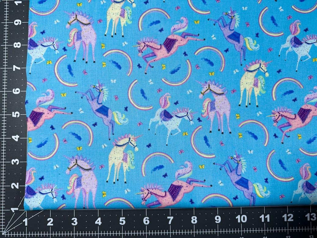 Moonbeams and Rainbows Unicorn fabric on Blue - Mary Jo Fabrics