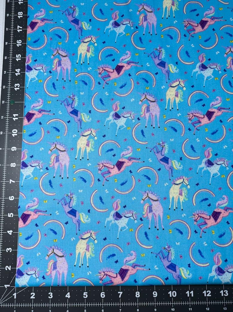 Moonbeams and Rainbows Unicorn fabric on Blue - Mary Jo Fabrics