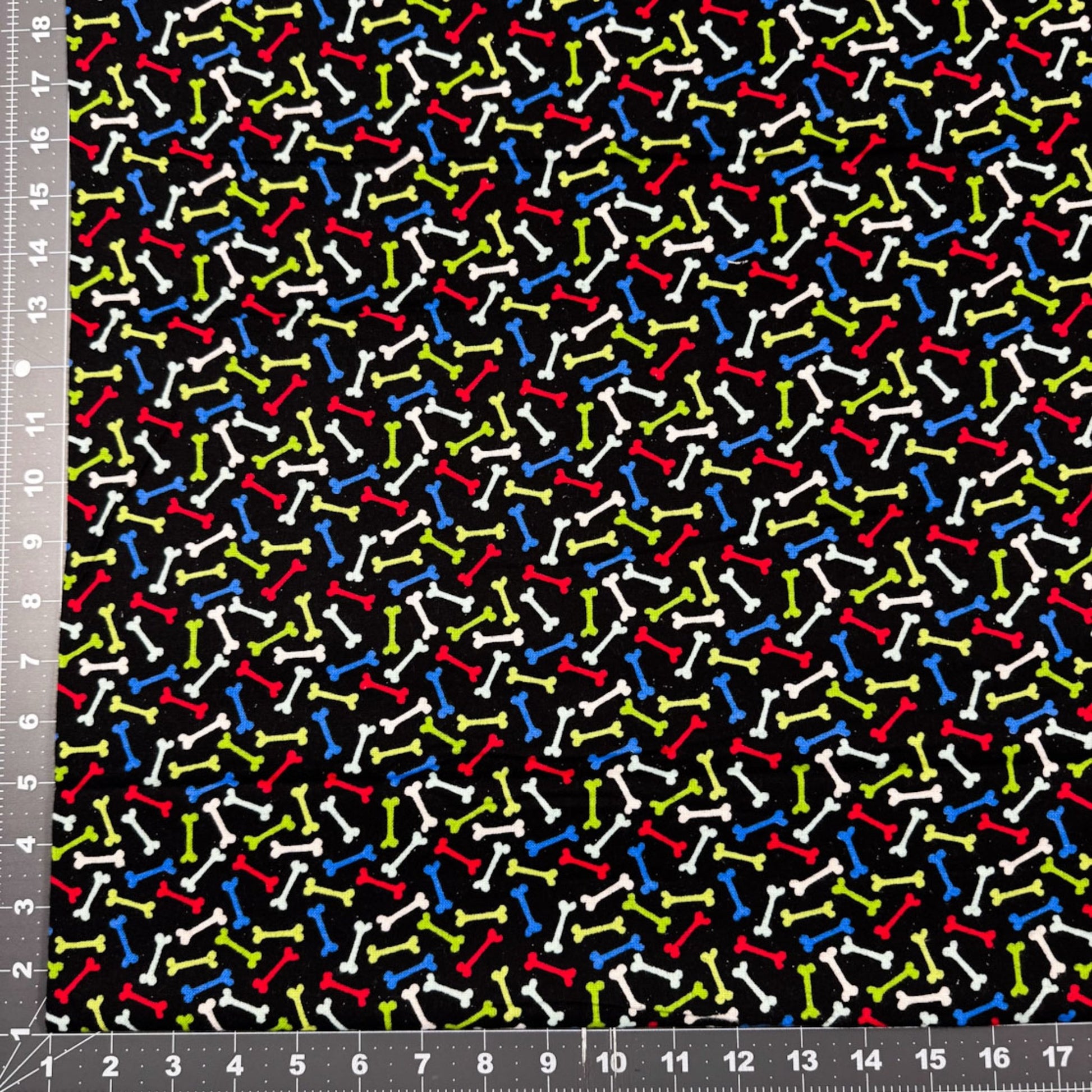 Multi Color Dog Bone FLANNEL Fabric 14706 Bones on Black - Mary Jo Fabrics