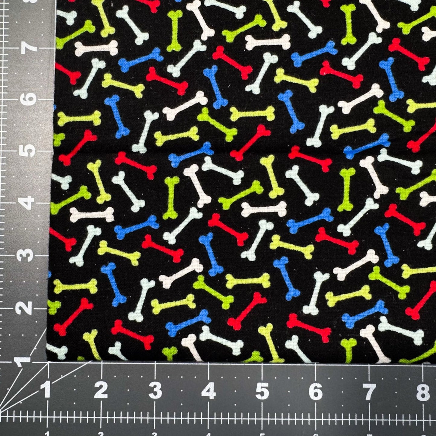 Multi Color Dog Bone FLANNEL Fabric 14706 Bones on Black - Mary Jo Fabrics