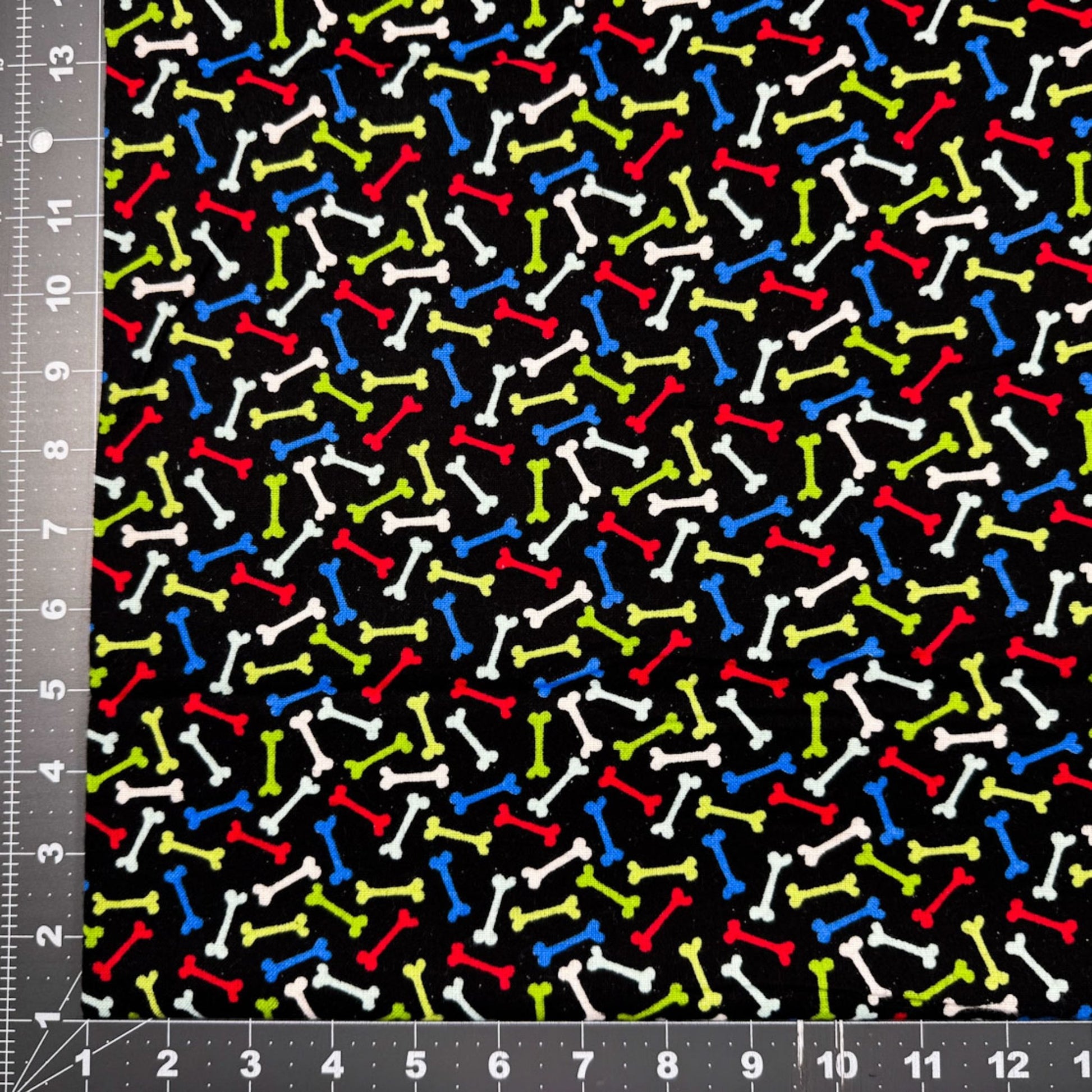 Multi Color Dog Bone FLANNEL Fabric 14706 Bones on Black - Mary Jo Fabrics