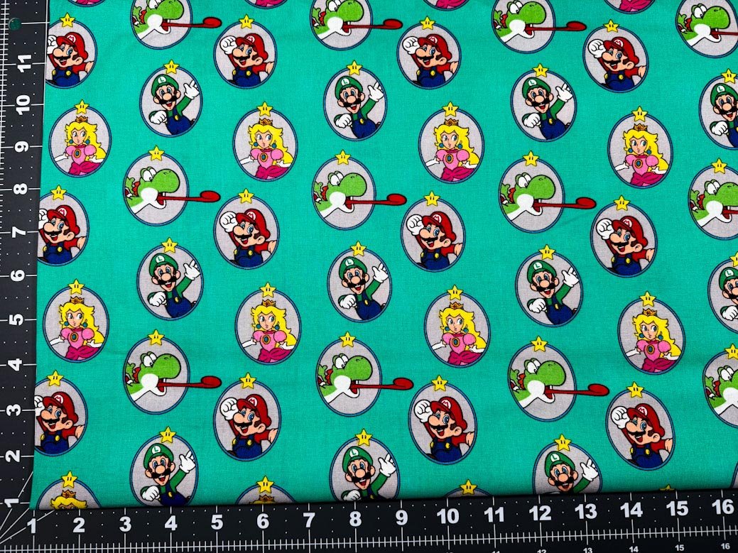 Nintendo Super Mario fabric Green Badges Yoshi - Mary Jo Fabrics