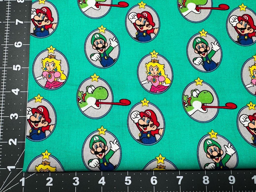 Nintendo Super Mario fabric Green Badges Yoshi - Mary Jo Fabrics