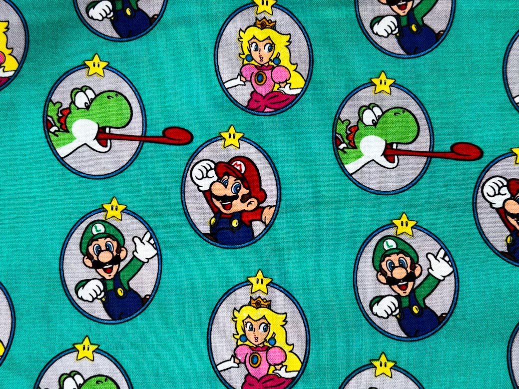 Nintendo Super Mario fabric Green Badges Yoshi - Mary Jo Fabrics