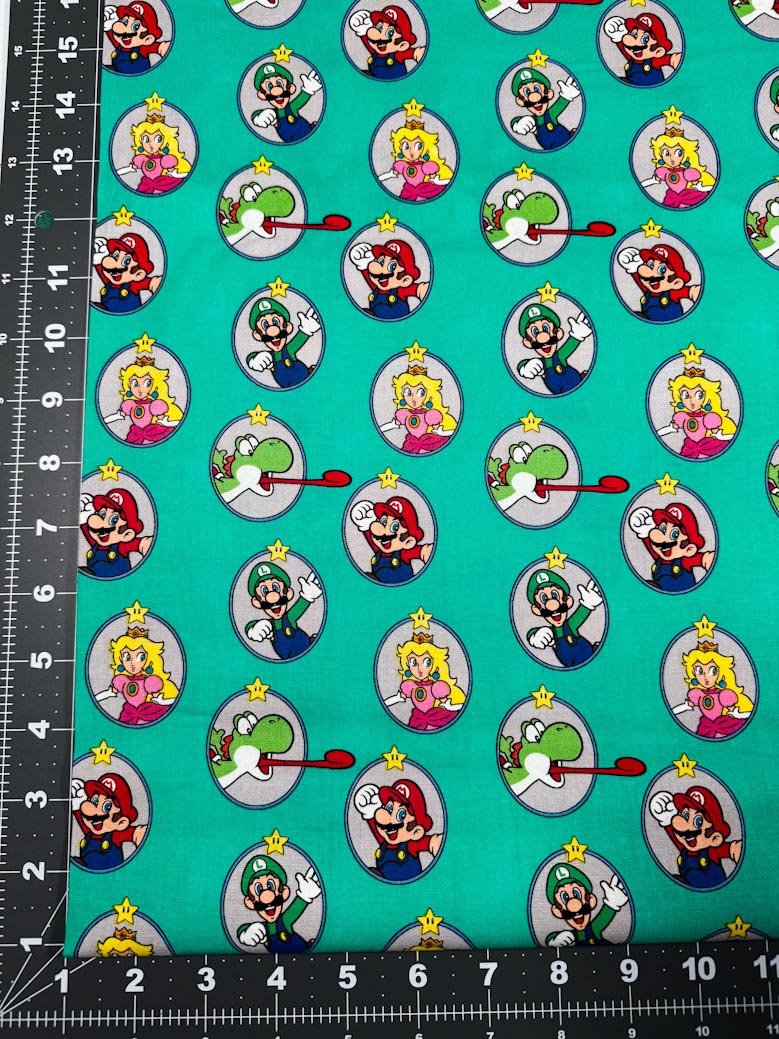 Nintendo Super Mario fabric Green Badges Yoshi - Mary Jo Fabrics