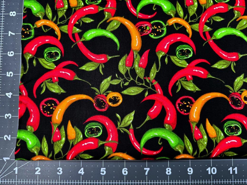 Red Hot Pepper fabric on black - Mary Jo Fabrics