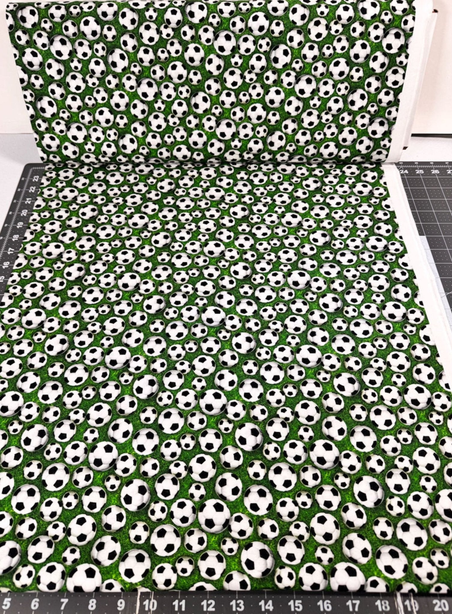 Soccer fabric 59-7771 White Soccer Balls on Grass fabric - Mary Jo Fabrics
