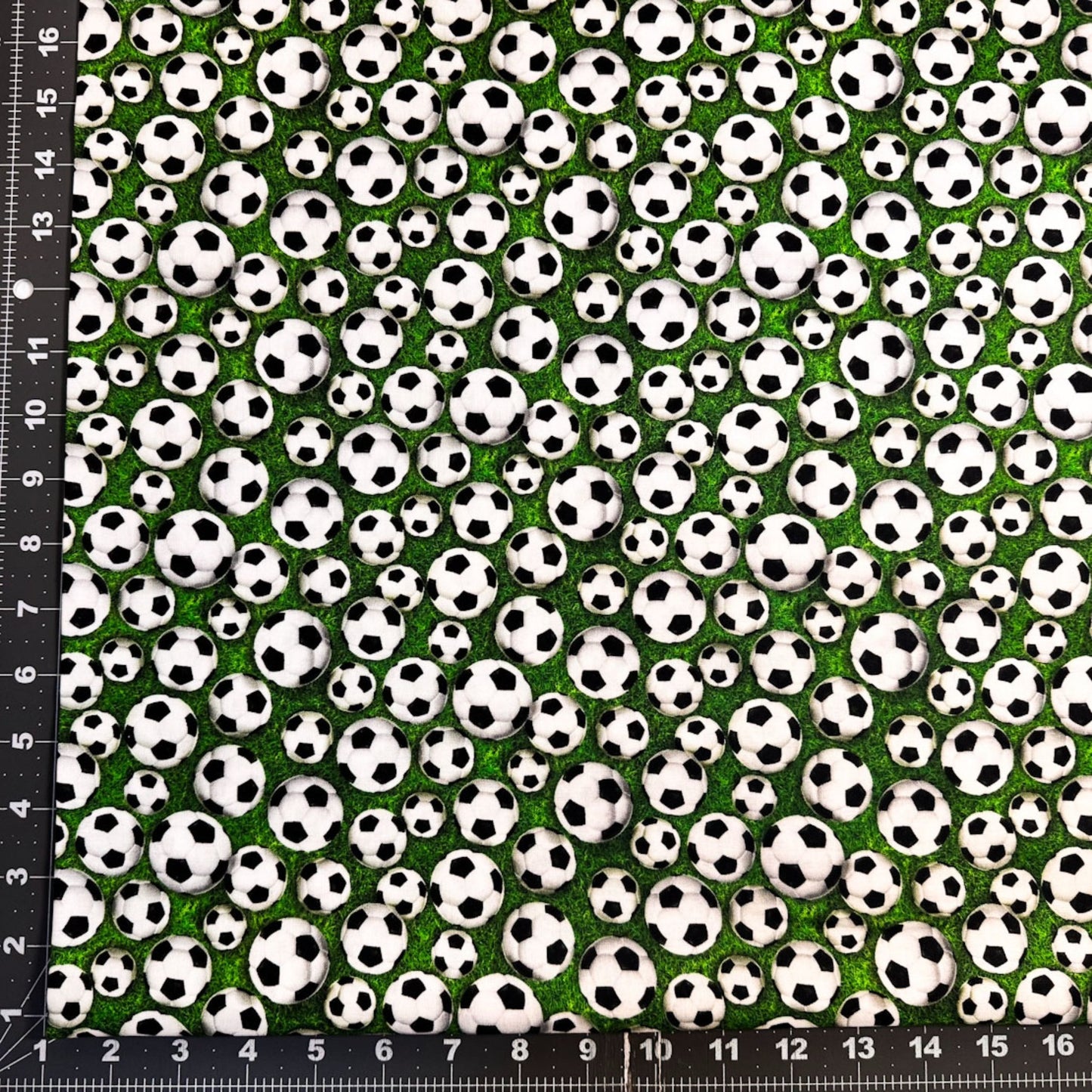 Soccer fabric 59-7771 White Soccer Balls on Grass fabric - Mary Jo Fabrics