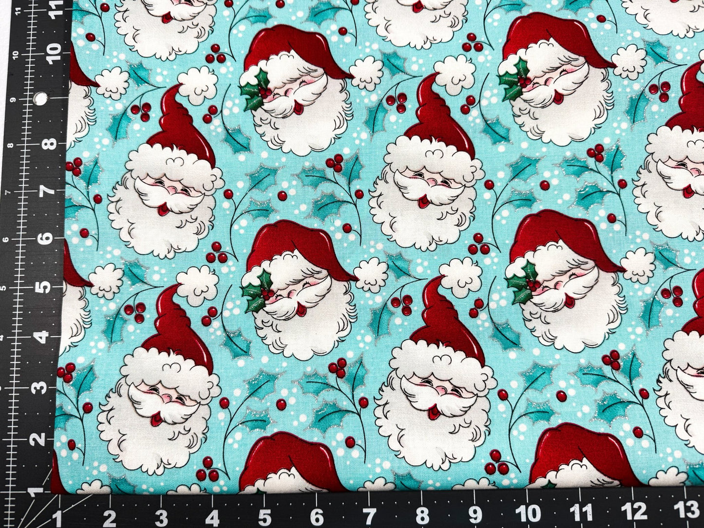 Tossed Santa faces w Glitter Christmas fabric - Mary Jo Fabrics