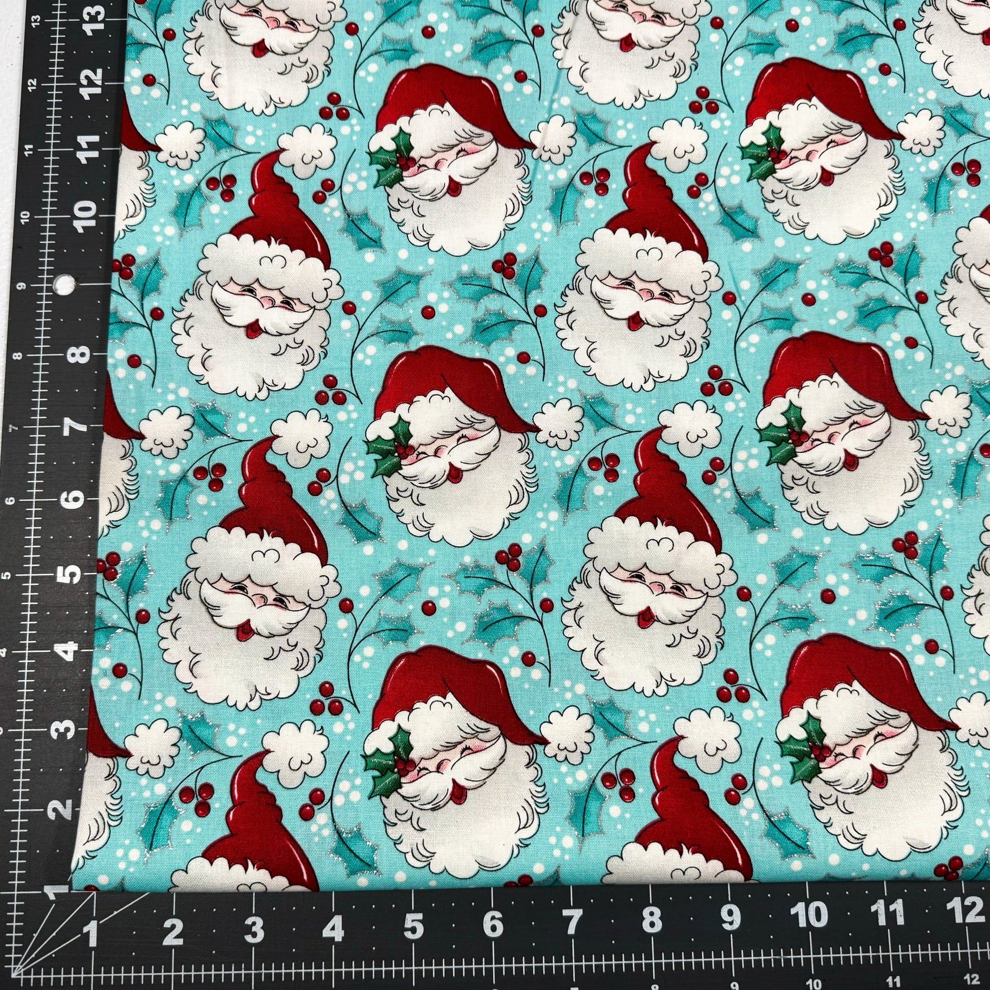 Tossed Santa faces w Glitter Christmas fabric - Mary Jo Fabrics