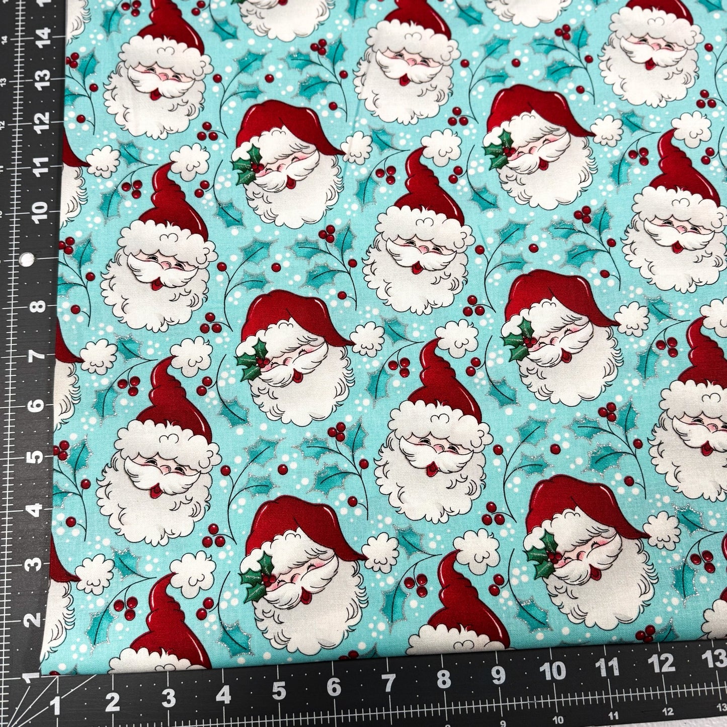 Tossed Santa faces w Glitter Christmas fabric - Mary Jo Fabrics