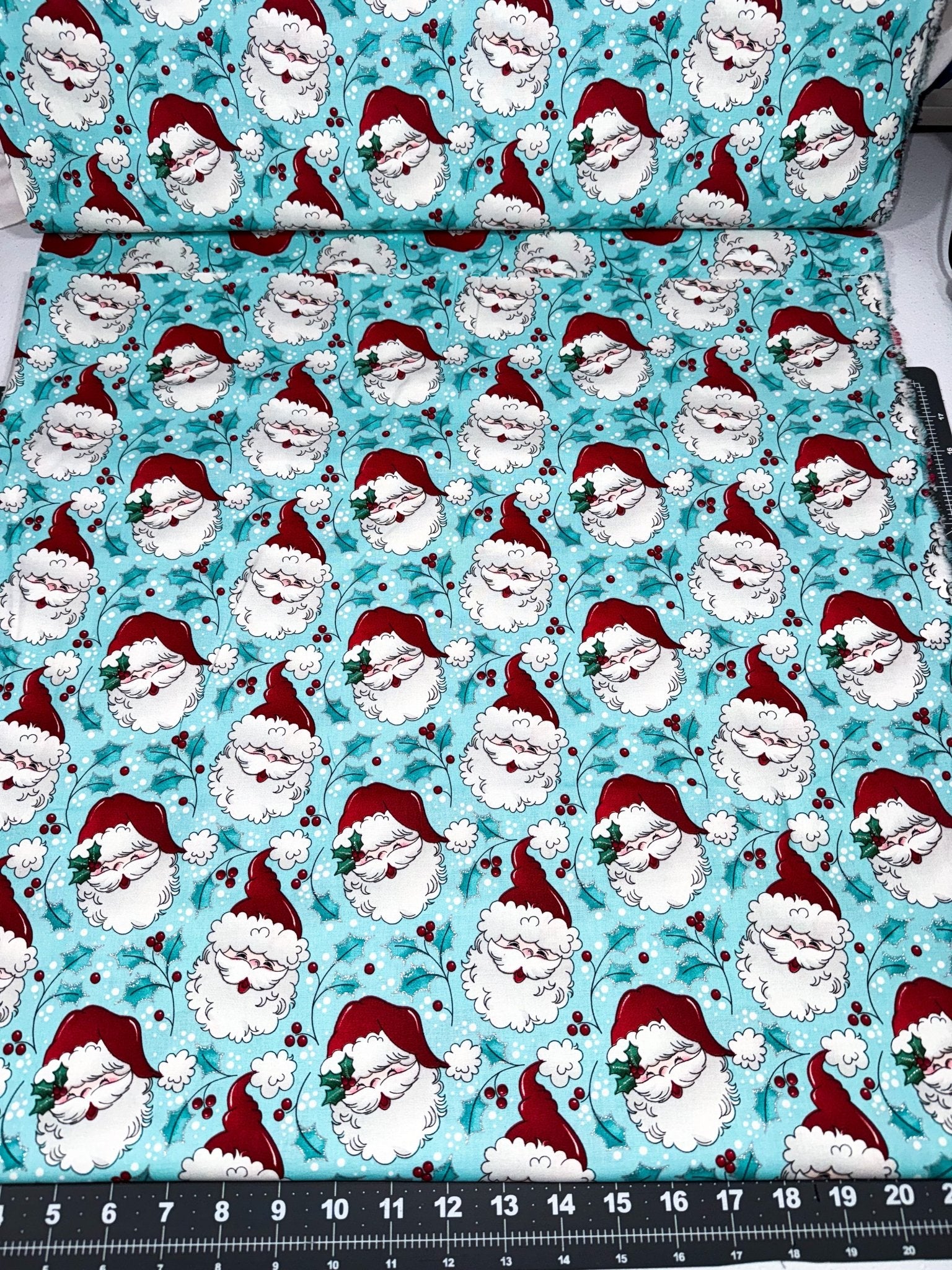 Tossed Santa faces w Glitter Christmas fabric - Mary Jo Fabrics