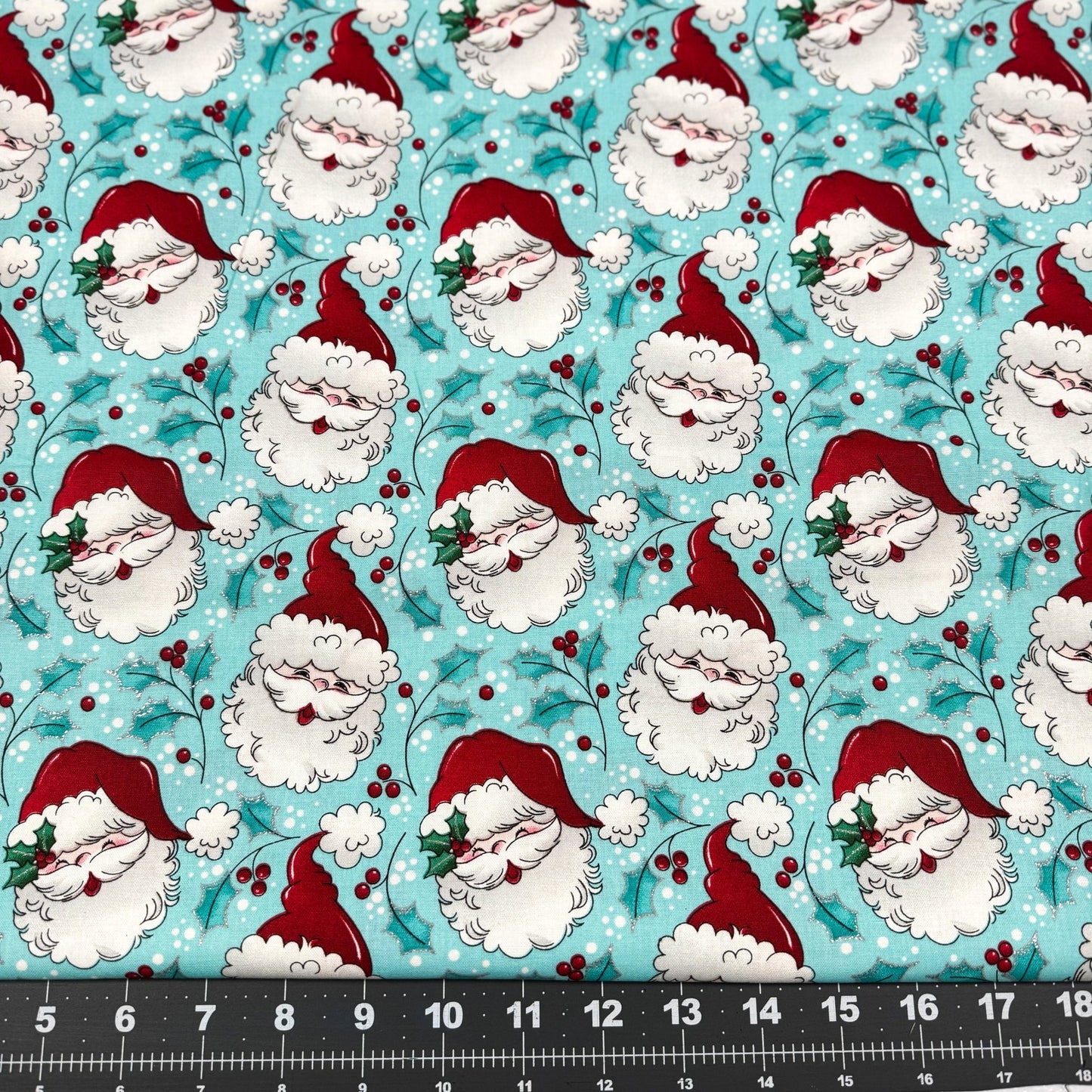 Tossed Santa faces w Glitter Christmas fabric - Mary Jo Fabrics