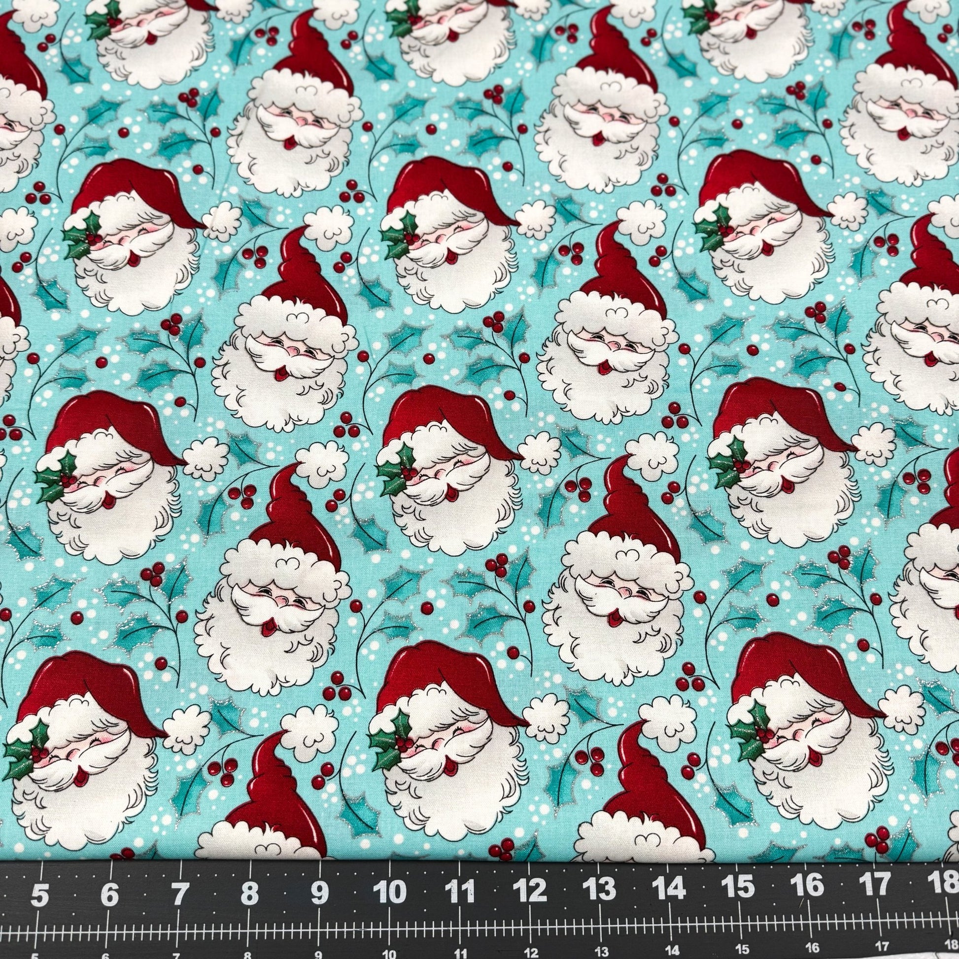 Tossed Santa faces w Glitter Christmas fabric - Mary Jo Fabrics