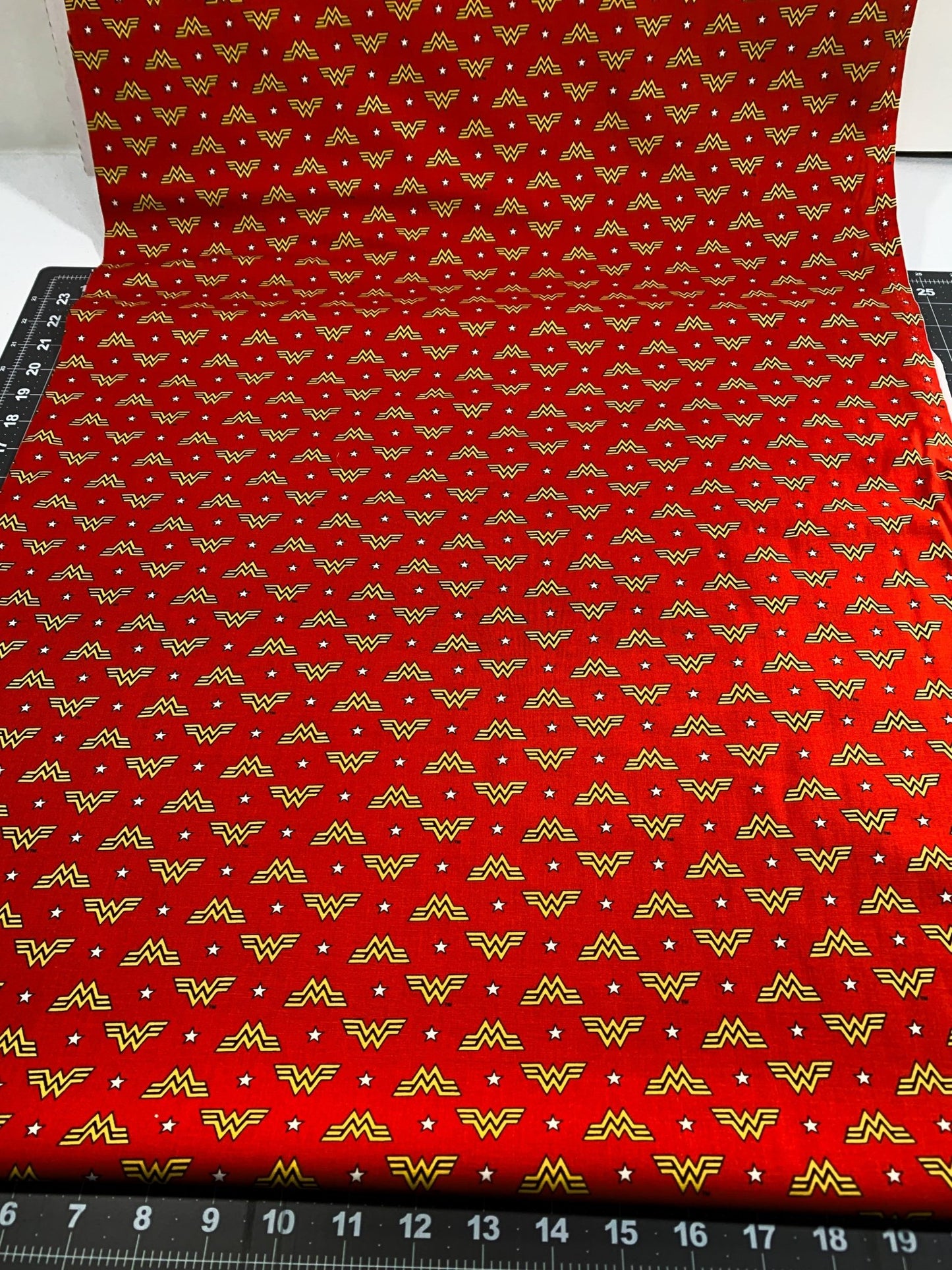 Wonder Woman fabric WW84 WW logo and stars - Mary Jo Fabrics