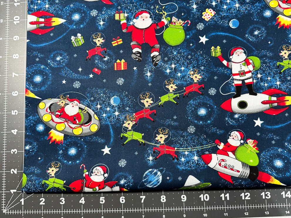 Yule Cool Santa Claus fabric D108 Santa in space - Mary Jo Fabrics