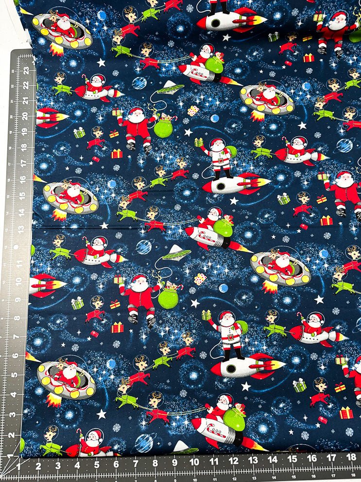 Yule Cool Santa Claus fabric D108 Santa in space - Mary Jo Fabrics