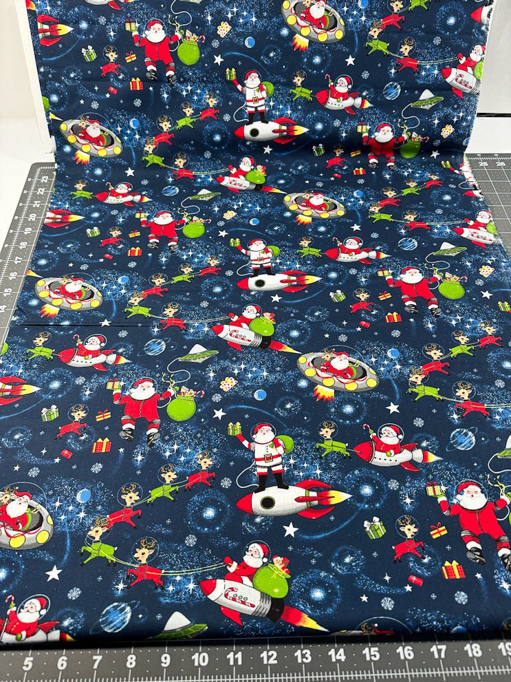 Yule Cool Santa Claus fabric D108 Santa in space - Mary Jo Fabrics